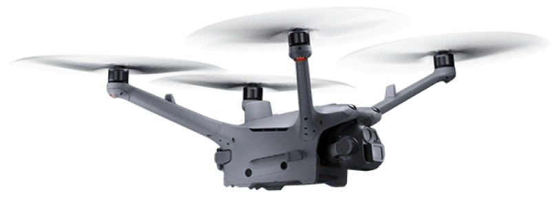 Side angle view of a security drone in flight with camera system and spinning propellers