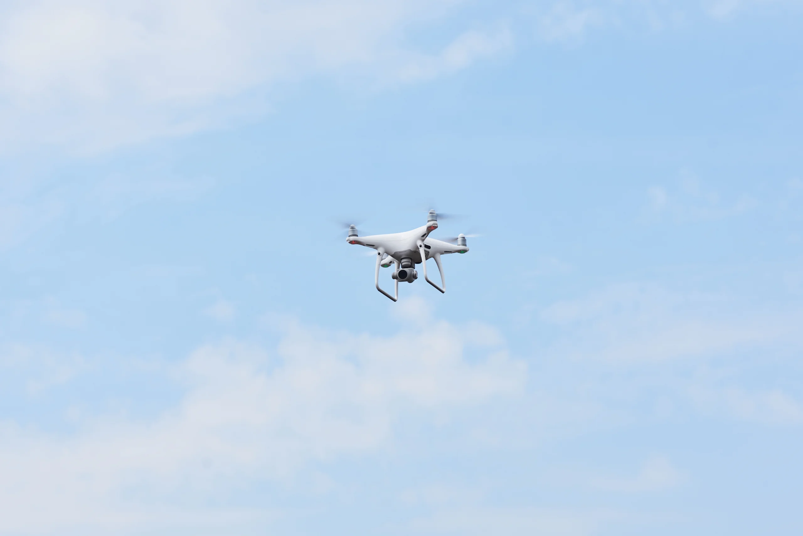 Security drone flying in sky with AI surveillance cameras