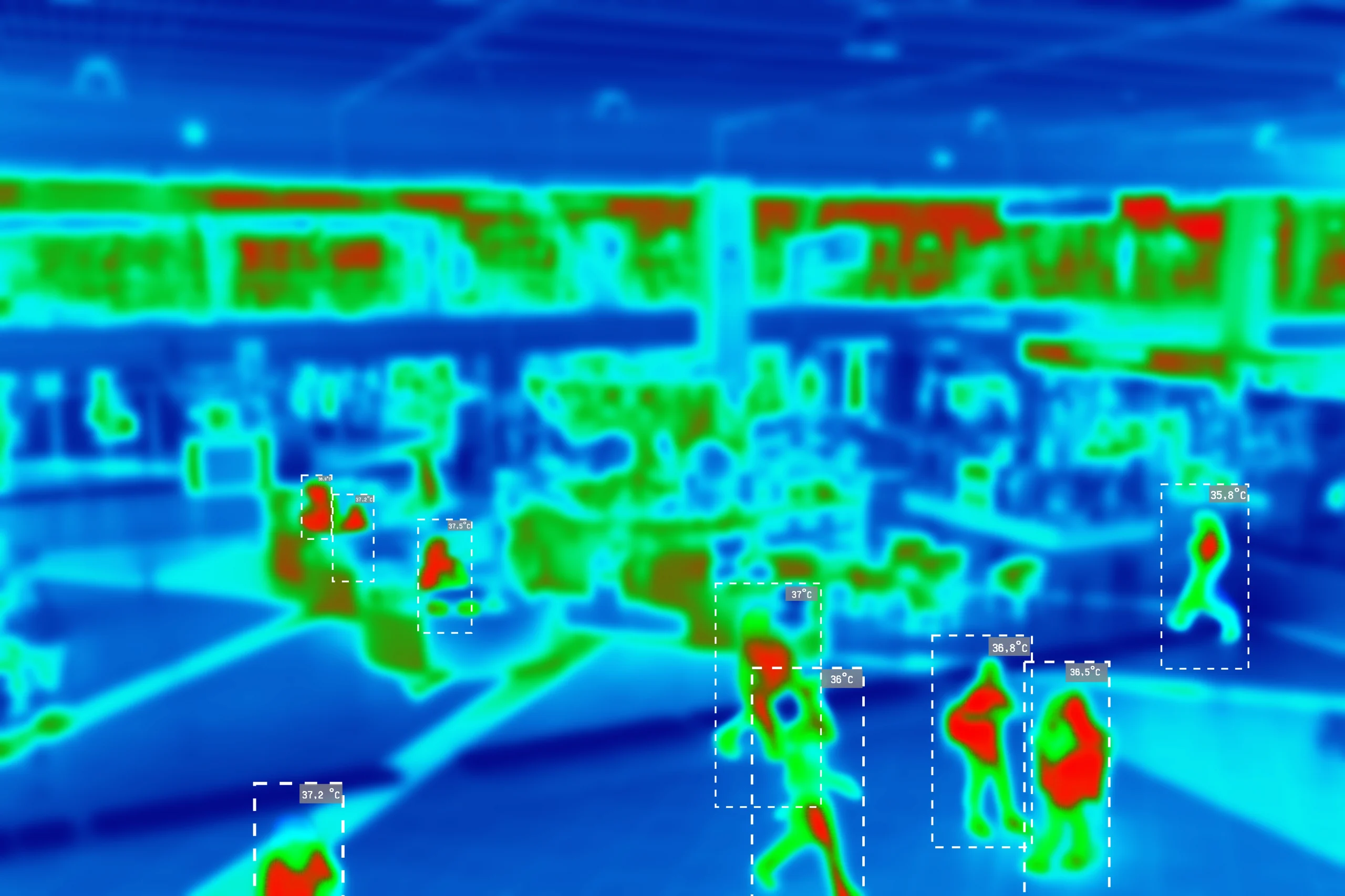 Thermal image captured by security drone of people walking around indoors at night